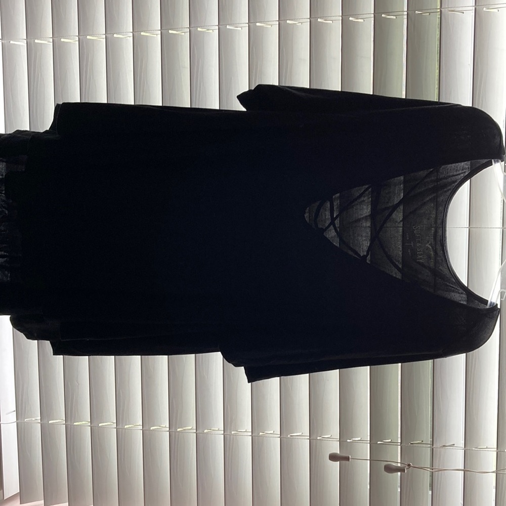 A black long shirts with x’s in the front